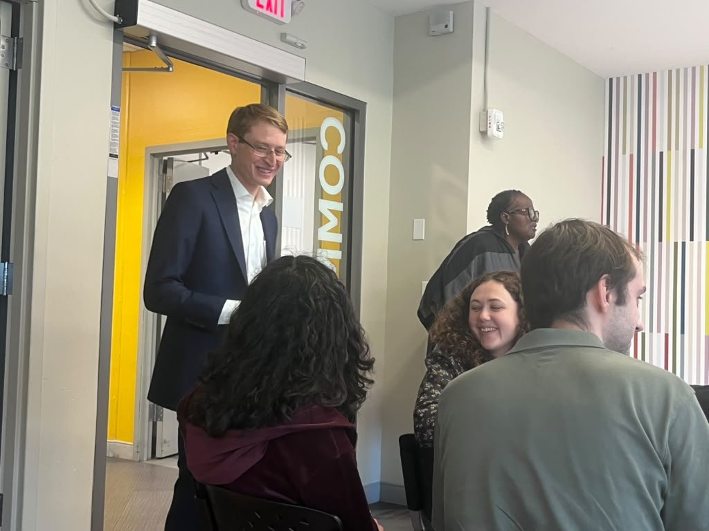 Neil greeting neighbors at a community event