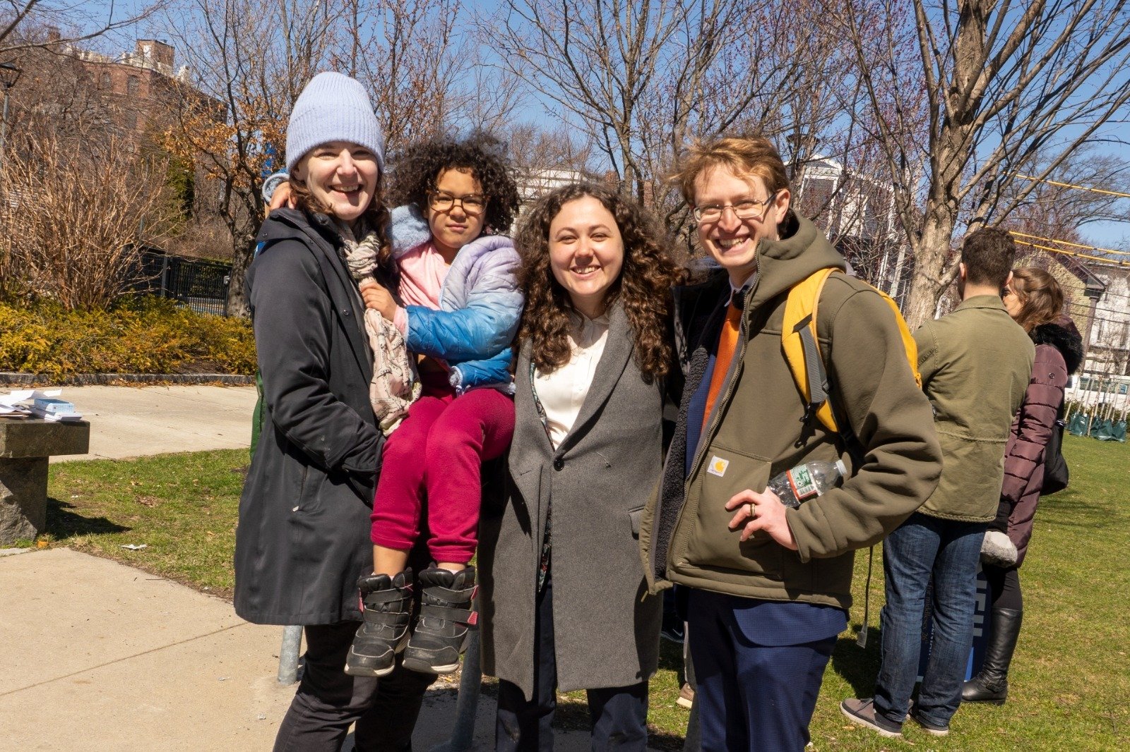 Neil with supporters and a young family at a neighborhood event